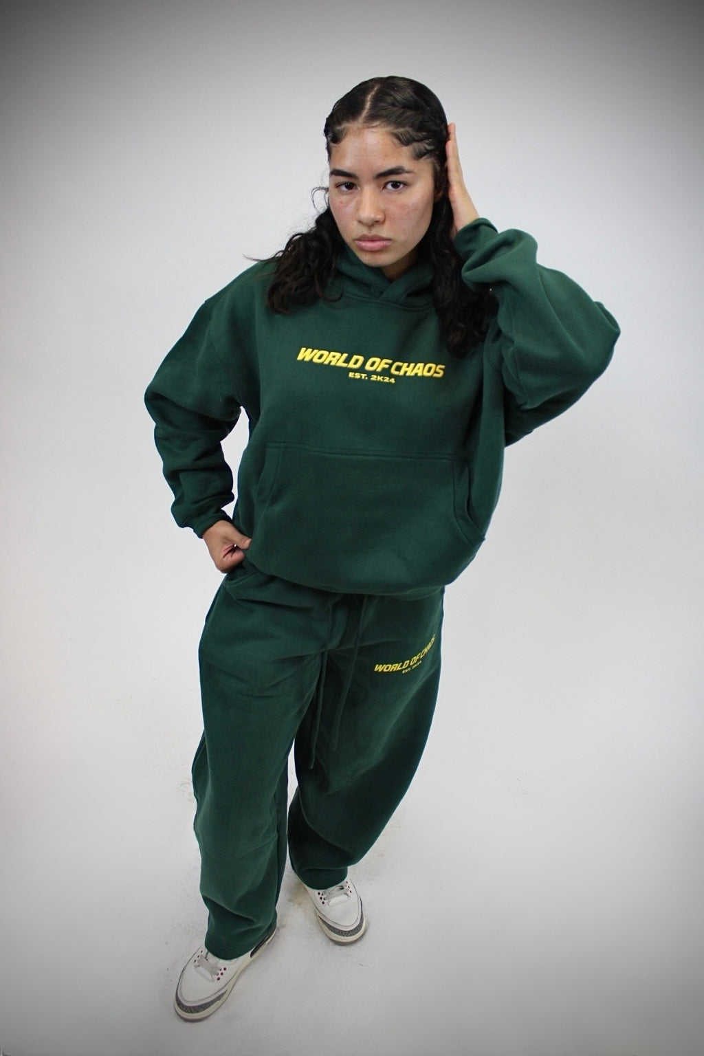 World of Chaos green sweatsuit campaign look